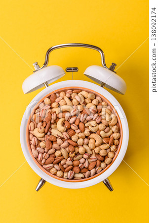 A mix of cashews, pistachios, almonds, brazil nuts, and hazelnuts. Nuts as a food background 138092174