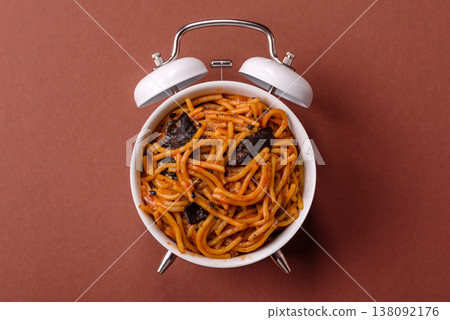 Yakisoba, Asian noodles with vegetables and meat, is a Chinese or Japanese food. Yakisoba or udon 138092176
