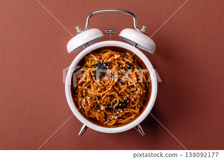 Yakisoba, Asian noodles with vegetables and meat, is a Chinese or Japanese food. Yakisoba or udon 138092177