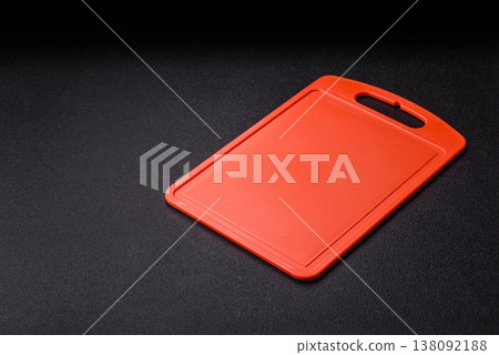 An empty plastic cutting board as a kitchen utensil. An empty plastic cutting board 138092188