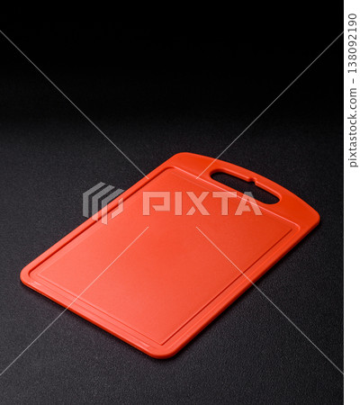 An empty plastic cutting board as a kitchen utensil. An empty plastic cutting board An empty plastic cutting board as a kitchen utensil. An empty plastic cutting board 138092190