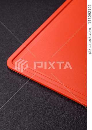 An empty plastic cutting board as a kitchen utensil. An empty plastic cutting board An empty plastic cutting board as a kitchen utensil. An empty plastic cutting board 138092193