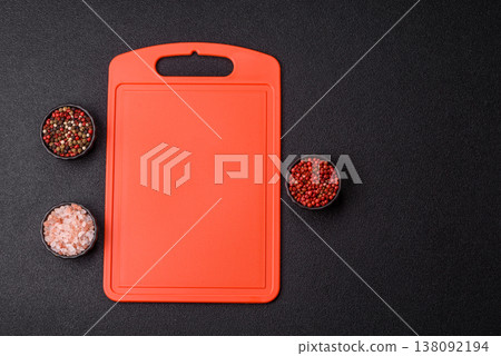 An empty plastic cutting board as a kitchen utensil. An empty plastic cutting board 138092194
