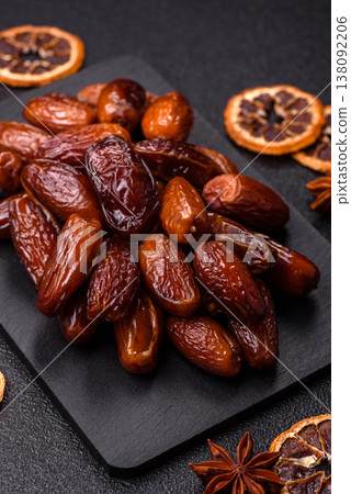 Dried dates on a ceramic plate for Ramadan or Iftar. Dates fruit as a background Dried dates on a ceramic plate for Ramadan or Iftar. Dates fruit as a background 138092206