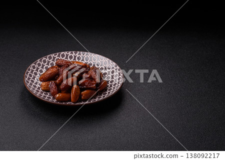Dried dates on a ceramic plate for Ramadan or Iftar. Dates fruit as a background 138092217