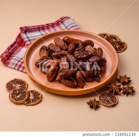 Dried dates on a ceramic plate for Ramadan or Iftar. Dates fruit as a background 138092230