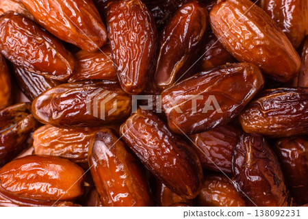 Dried dates on a ceramic plate for Ramadan or Iftar. Dates fruit as a background Dried dates on a ceramic plate for Ramadan or Iftar. Dates fruit as a background 138092231