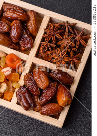 Dried dates on a ceramic plate for Ramadan or Iftar. Dates fruit as a background Dried dates on a ceramic plate for Ramadan or Iftar. Dates fruit as a background 138092238