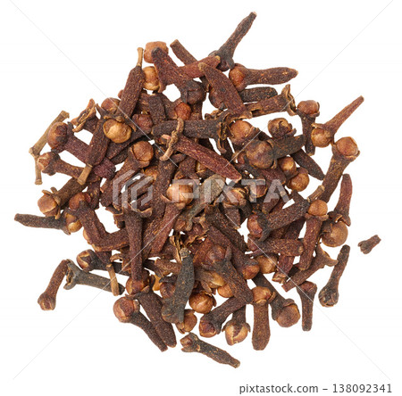 A handful of whole dried clove buds piled up on an isolated background A handful of whole dried clove buds piled up on an isolated background 138092341
