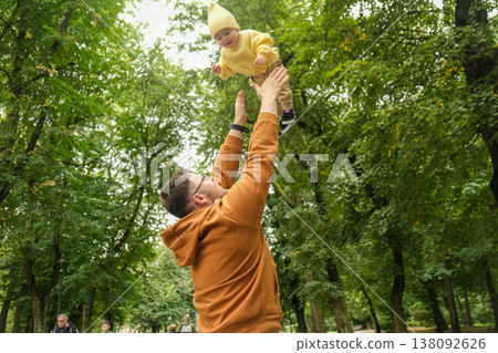 Father and Baby Enjoying a Day in the Park Father and Baby Enjoying a Day in the Park 138092626