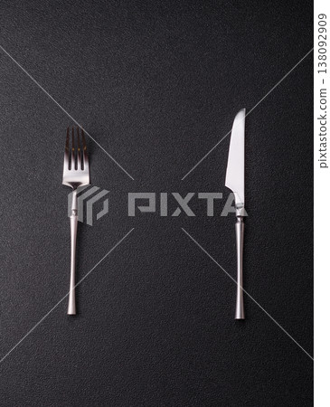 A knife and fork, silver kitchen utensils for the dining table. A knife and fork A knife and fork, silver kitchen utensils for the dining table. A knife and fork 138092909