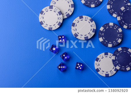 Casino dice and chips on a colored background, poker, gambling with bets. Dice and chips Casino dice and chips on a colored background, poker, gambling with bets. Dice and chips 138092920