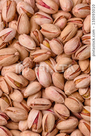 Salted pistachio nuts in shells as a healthy, high calorie food ingredient. Pistachio nuts 138093010