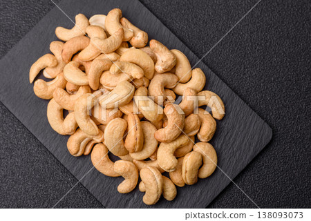 Roasted or raw cashew make a savory snack for a healthy, filling meal. Cashew nuts Roasted or raw cashew make a savory snack for a healthy, filling meal. Cashew nuts 138093073