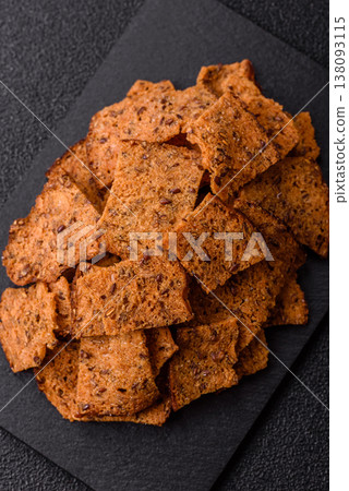 Croutons or crackers made from rye bread with garlic, salt, and spices. Croutons with salt Croutons or crackers made from rye bread with garlic, salt, and spices. Croutons with salt 138093115