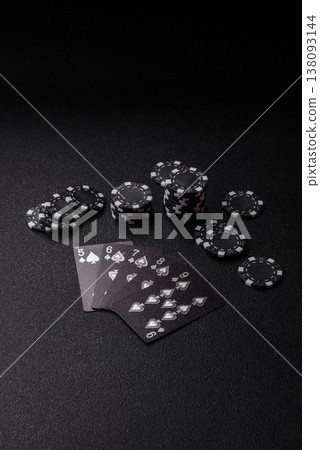 Playing cards and chips on a table, a gambling game of poker. Cards and chips Playing cards and chips on a table, a gambling game of poker. Cards and chips 138093144