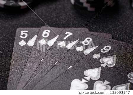 Playing cards and chips on a table, a gambling game of poker. Cards and chips Playing cards and chips on a table, a gambling game of poker. Cards and chips 138093147