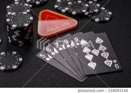 Playing cards and chips on a table, a gambling game of poker. Cards and chips Playing cards and chips on a table, a gambling game of poker. Cards and chips 138093148