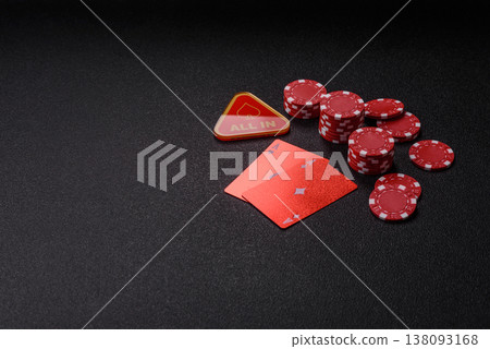 Playing cards and chips on a table, a gambling game of blackjack or baccarat. Cards and chips Playing cards and chips on a table, a gambling game of blackjack or baccarat. Cards and chips 138093168