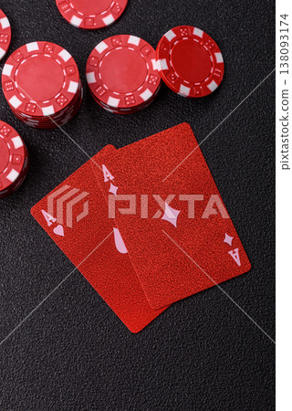 Playing cards and chips on a table, a gambling game of blackjack or baccarat. Cards and chips Playing cards and chips on a table, a gambling game of blackjack or baccarat. Cards and chips 138093174