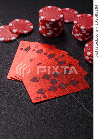 Playing cards and chips on a table, a gambling game of poker. Cards and chips Playing cards and chips on a table, a gambling game of poker. Cards and chips 138093184