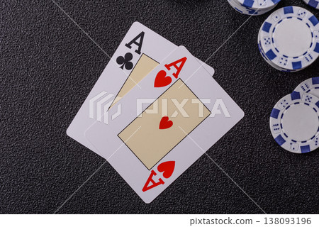 Playing cards and chips on a table, a gambling game of blackjack or baccarat. Cards and chips Playing cards and chips on a table, a gambling game of blackjack or baccarat. Cards and chips 138093196