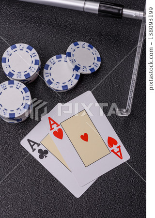 Playing cards and chips on a table, a gambling game of blackjack or baccarat. Cards and chips Playing cards and chips on a table, a gambling game of blackjack or baccarat. Cards and chips 138093199
