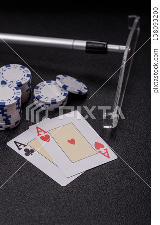 Playing cards and chips on a table, a gambling game of blackjack or baccarat. Cards and chips Playing cards and chips on a table, a gambling game of blackjack or baccarat. Cards and chips 138093200
