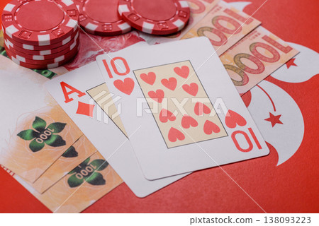 Playing cards and chips on a table, a gambling game of blackjack or baccarat. Cards and chips Playing cards and chips on a table, a gambling game of blackjack or baccarat. Cards and chips 138093223