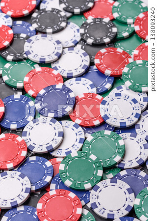 Multicolored casino chips as a conceptual backdrop for poker, blackjack. Multicolored casino chips Multicolored casino chips as a conceptual backdrop for poker, blackjack. Multicolored casino chips 138093240