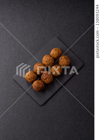 Falafel, a hearty Arabic dish made from boiled chickpeas for vegetarians. Chickpea falafel Falafel, a hearty Arabic dish made from boiled chickpeas for vegetarians. Chickpea falafel 138093244