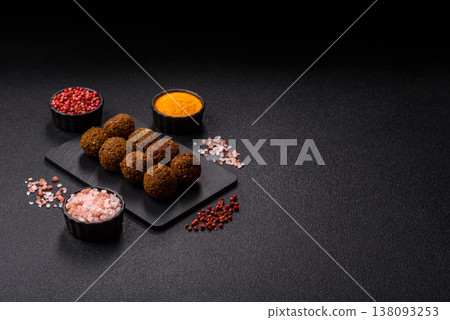 Falafel, a hearty Arabic dish made from boiled chickpeas for vegetarians. Chickpea falafel Falafel, a hearty Arabic dish made from boiled chickpeas for vegetarians. Chickpea falafel 138093253