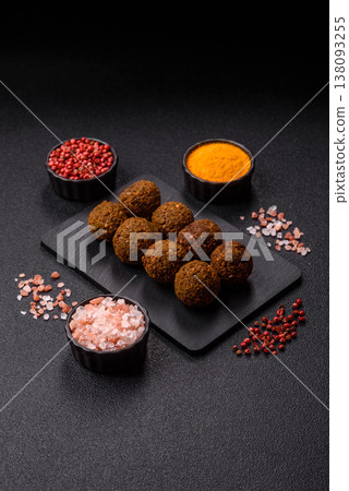 Falafel, a hearty Arabic dish made from boiled chickpeas for vegetarians. Chickpea falafel Falafel, a hearty Arabic dish made from boiled chickpeas for vegetarians. Chickpea falafel 138093255