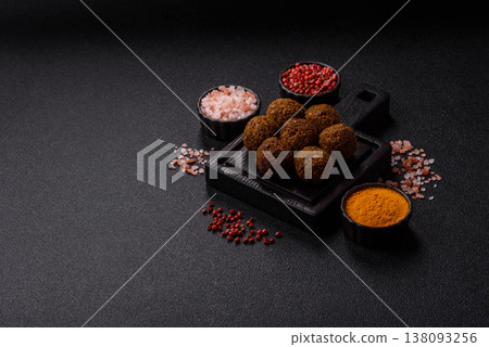 Falafel, a hearty Arabic dish made from boiled chickpeas for vegetarians. Chickpea falafel Falafel, a hearty Arabic dish made from boiled chickpeas for vegetarians. Chickpea falafel 138093256