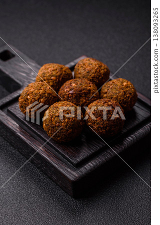 Falafel, a hearty Arabic dish made from boiled chickpeas for vegetarians. Chickpea falafel Falafel, a hearty Arabic dish made from boiled chickpeas for vegetarians. Chickpea falafel 138093265