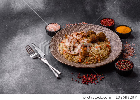 Kabsa or mandi, an Arabic dish with rice and chicken, salt, and spices. Kabsa or mandi Kabsa or mandi, an Arabic dish with rice and chicken, salt, and spices. Kabsa or mandi 138093297