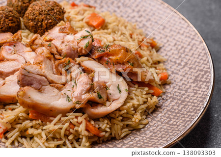 Kabsa or mandi, an Arabic dish with rice and chicken, salt, and spices. Kabsa or mandi Kabsa or mandi, an Arabic dish with rice and chicken, salt, and spices. Kabsa or mandi 138093303