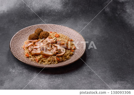 Kabsa or mandi, an Arabic dish with rice and chicken, salt, and spices. Kabsa or mandi Kabsa or mandi, an Arabic dish with rice and chicken, salt, and spices. Kabsa or mandi 138093306