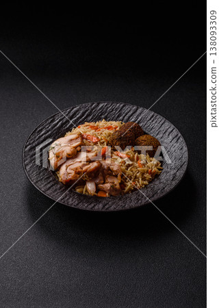 Kabsa or mandi, an Arabic dish with rice and chicken, salt, and spices. Kabsa or mandi Kabsa or mandi, an Arabic dish with rice and chicken, salt, and spices. Kabsa or mandi 138093309