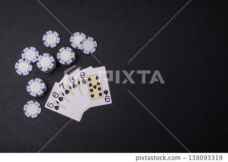 Playing cards and chips on a table, a gambling game of poker. Cards and chips Playing cards and chips on a table, a gambling game of poker. Cards and chips 138093319