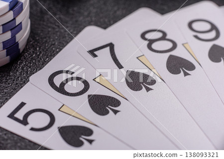 Playing cards and chips on a table, a gambling game of poker. Cards and chips Playing cards and chips on a table, a gambling game of poker. Cards and chips 138093321