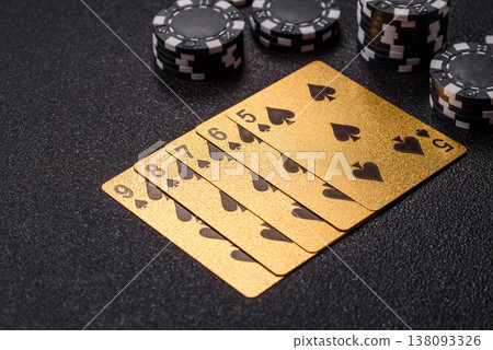 Playing cards and chips on a table, a gambling game of poker. Cards and chips Playing cards and chips on a table, a gambling game of poker. Cards and chips 138093326