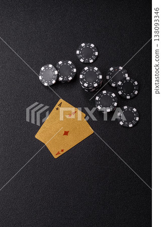 Playing cards and chips on a table, a gambling game of blackjack or baccarat. Cards and chips Playing cards and chips on a table, a gambling game of blackjack or baccarat. Cards and chips 138093346