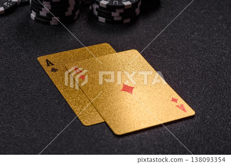 Playing cards and chips on a table, a gambling game of blackjack or baccarat. Cards and chips Playing cards and chips on a table, a gambling game of blackjack or baccarat. Cards and chips 138093354