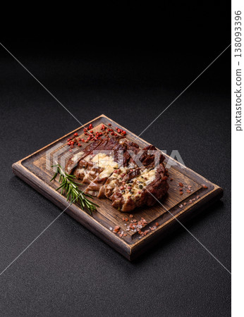 Steak, beef or pork meat grilled or barbecued with salt and spices. Beef steak 138093396