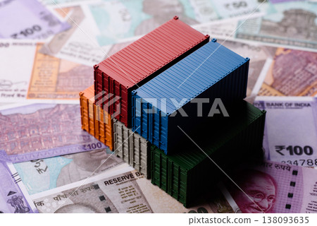 Cargo containers on the Indian money as a conceptual backdrop for goods export. Cargo containers 138093635