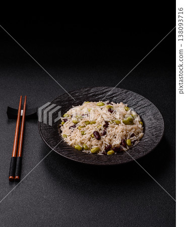 Asian food with rice, edamame, carrots, tofu, and spices. Rice with edamame Asian food with rice, edamame, carrots, tofu, and spices. Rice with edamame 138093716