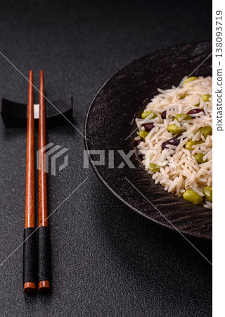 Asian food with rice, edamame, carrots, tofu, and spices. Rice with edamame 138093719