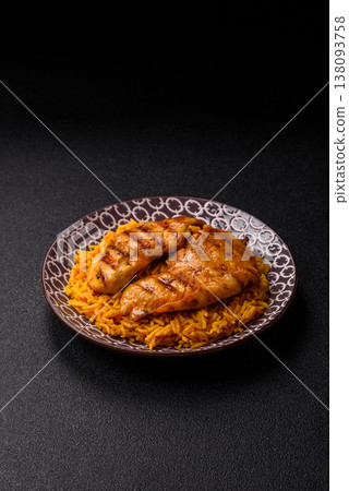Kabsa or haneeth, an Arabic dish with rice and chicken, salt, and spices. Kabsa or haneeth 138093758