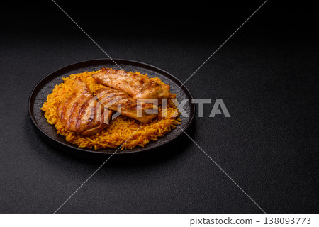 Kabsa or haneeth, an Arabic dish with rice and chicken, salt, and spices. Kabsa or haneeth 138093773